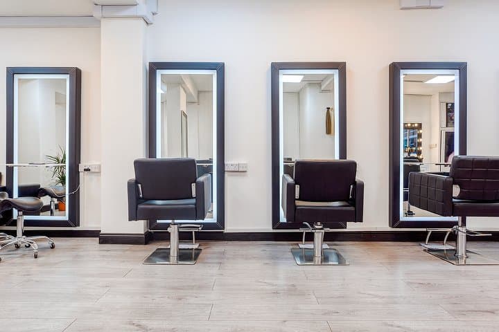 Styling chairs and lighted mirrors at The Metin London Beauty